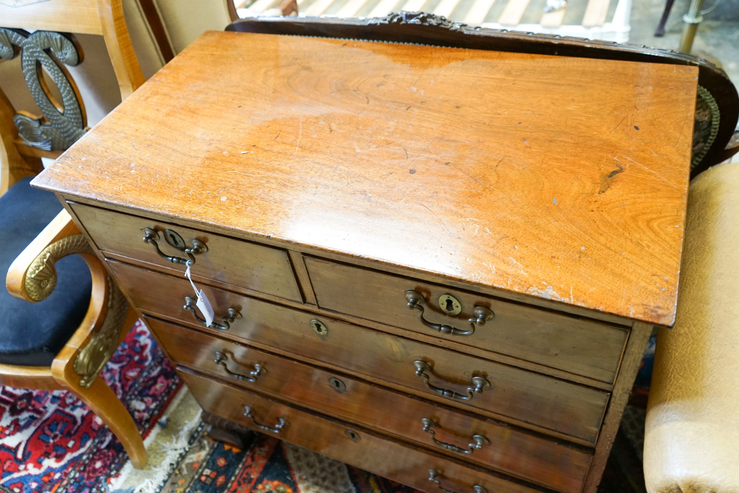 A George III mahogany chest of three long and two short drawers, on carved ogee bracket feet, width 95cm, depth 52cm, height 89cm